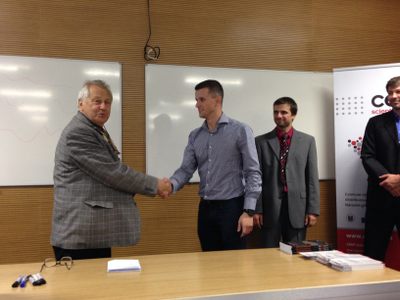 Prof. Gruska congratulates to Martin who won poster session at FI MU with his NTCIR-11 poster